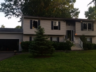 Fire Damaged Home - Front View BEFORE, insurance repair contractor